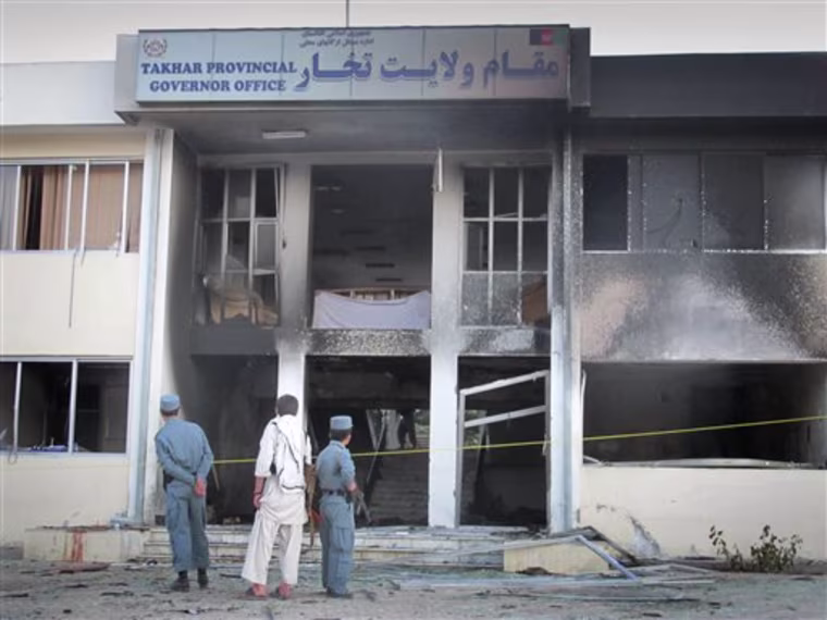 In this Saturday, May 28, 2011 photo, Afghan security guards stand at the site where a suicide bomber blew himself up inside the provincial governor's compound in Taloqan, Takhar province, north of Kabul, Afghanistan, killing Gen. Daud Daud. Daud, an ethnic Tajik, was the fifth minority leader slain by militants in recent months. He was killed in one of a series of high-profile bombings insurgents have been carrying out across the nation. Rising ethnic tensions are jeopardizing efforts to make peace with the Taliban after nearly 10 years of war. (AP Photo/Fulad Hamdard)